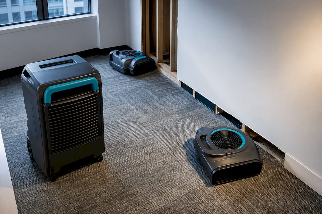 Air movers and dehumidifier drying office